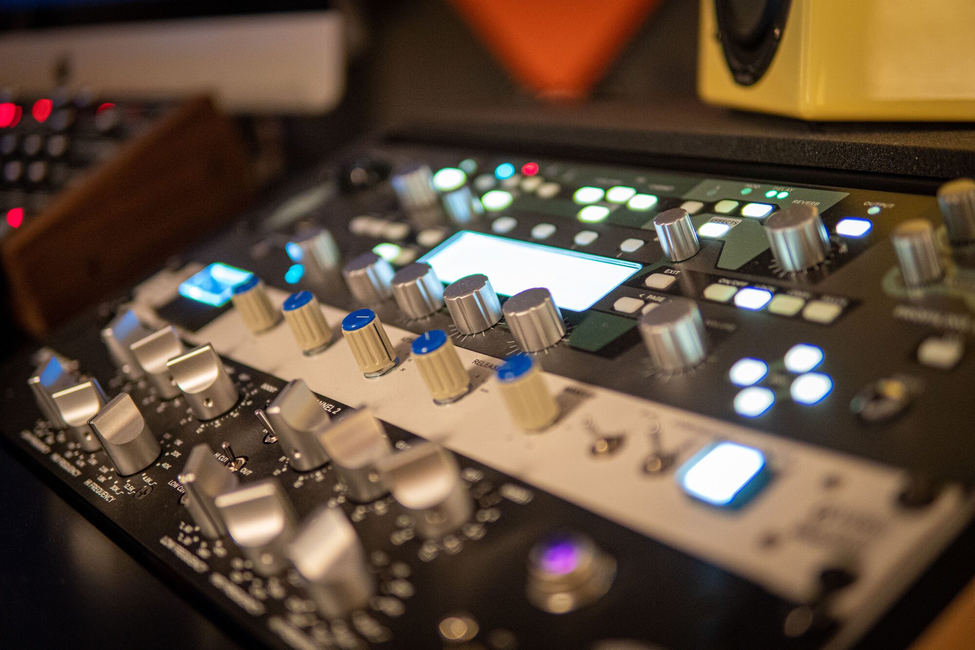 Analog preamp rack close-up with silver knobs