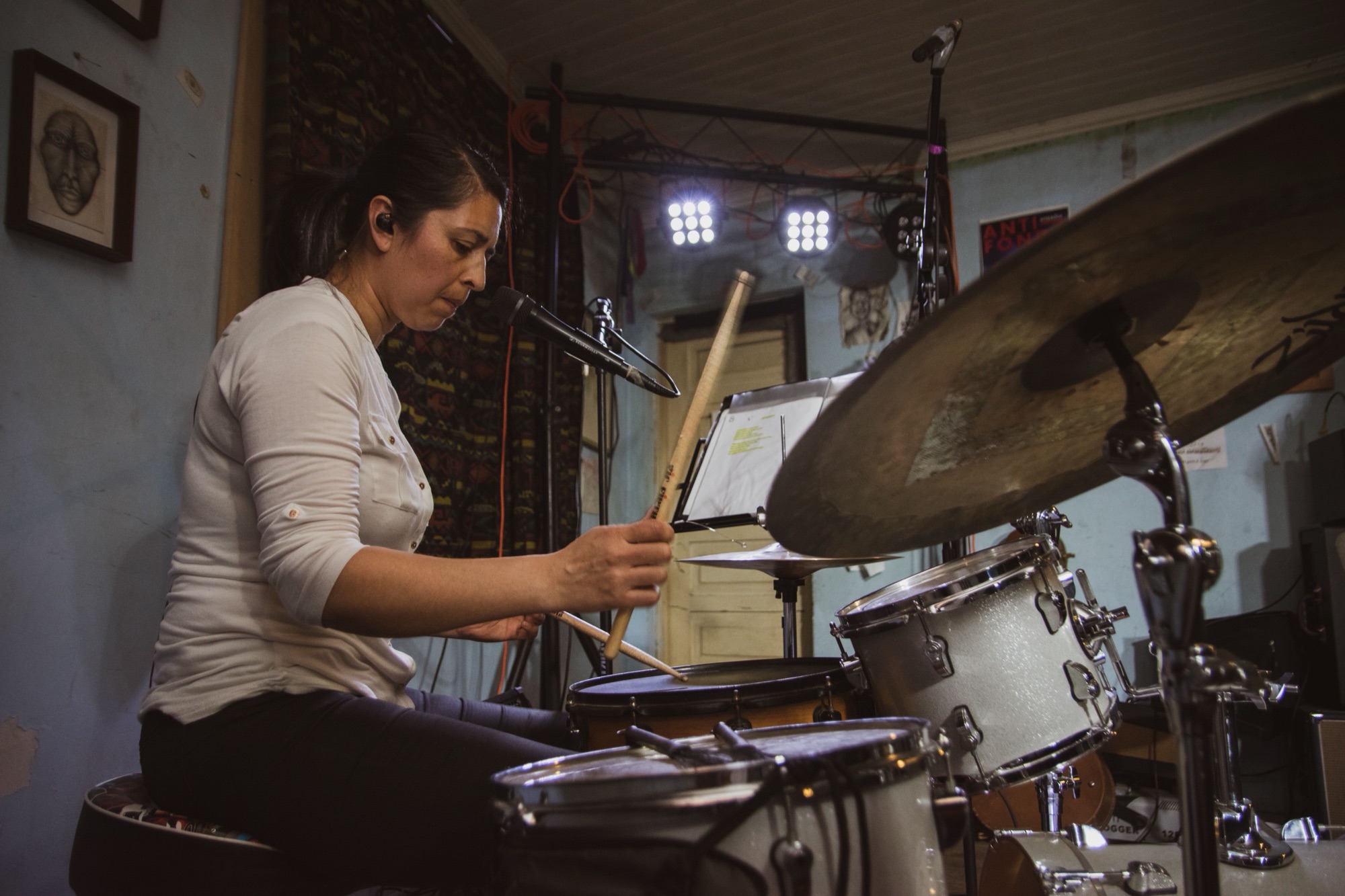 Drummer playing in a home studio