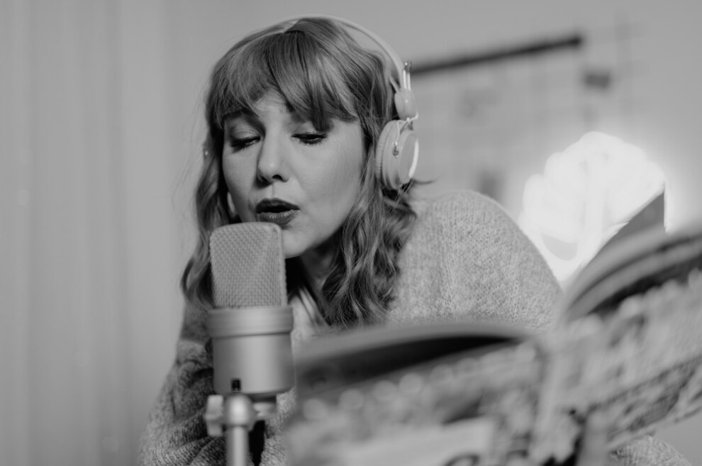 Vocalist singing into a condenser microphone