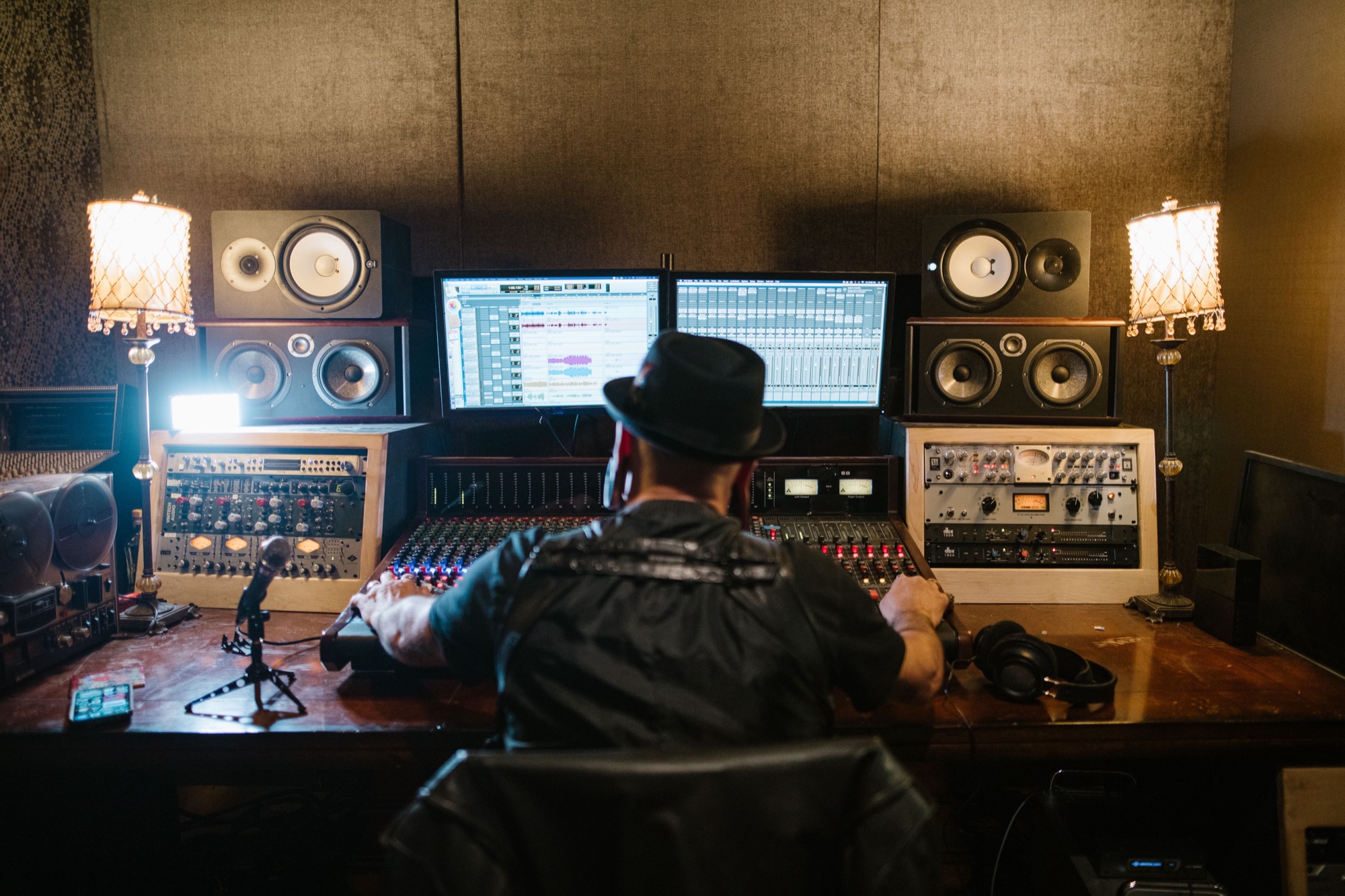 Engineer working at a vintage analog console