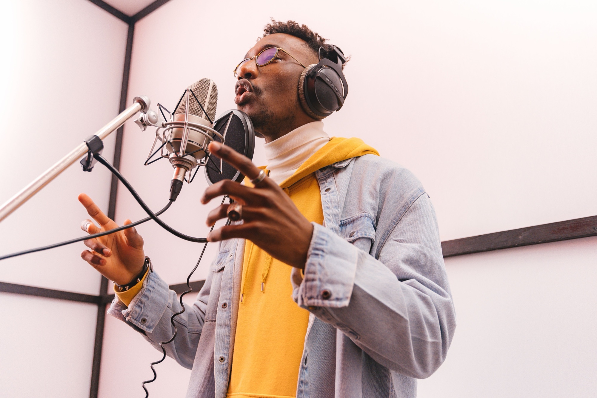 Vocalist recording in a booth