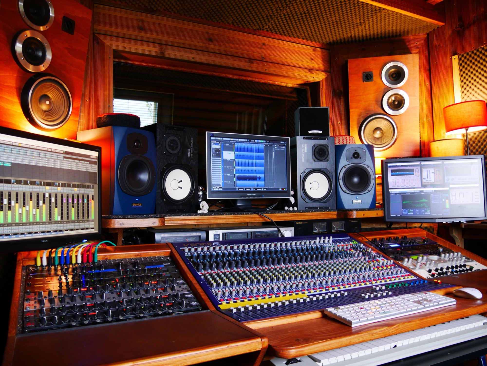 Warm wooden control room with analog console and vintage monitors